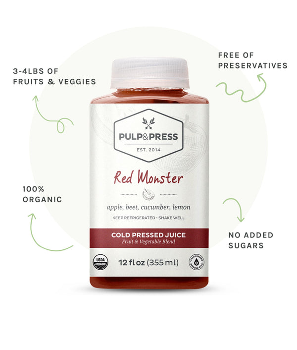 Bottle of red monster juice. 3 to 4 pounds of fruit and veggies. Free of preservatives. 100% organic. No added sugars.