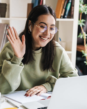 Woman offering customer support on a laptop